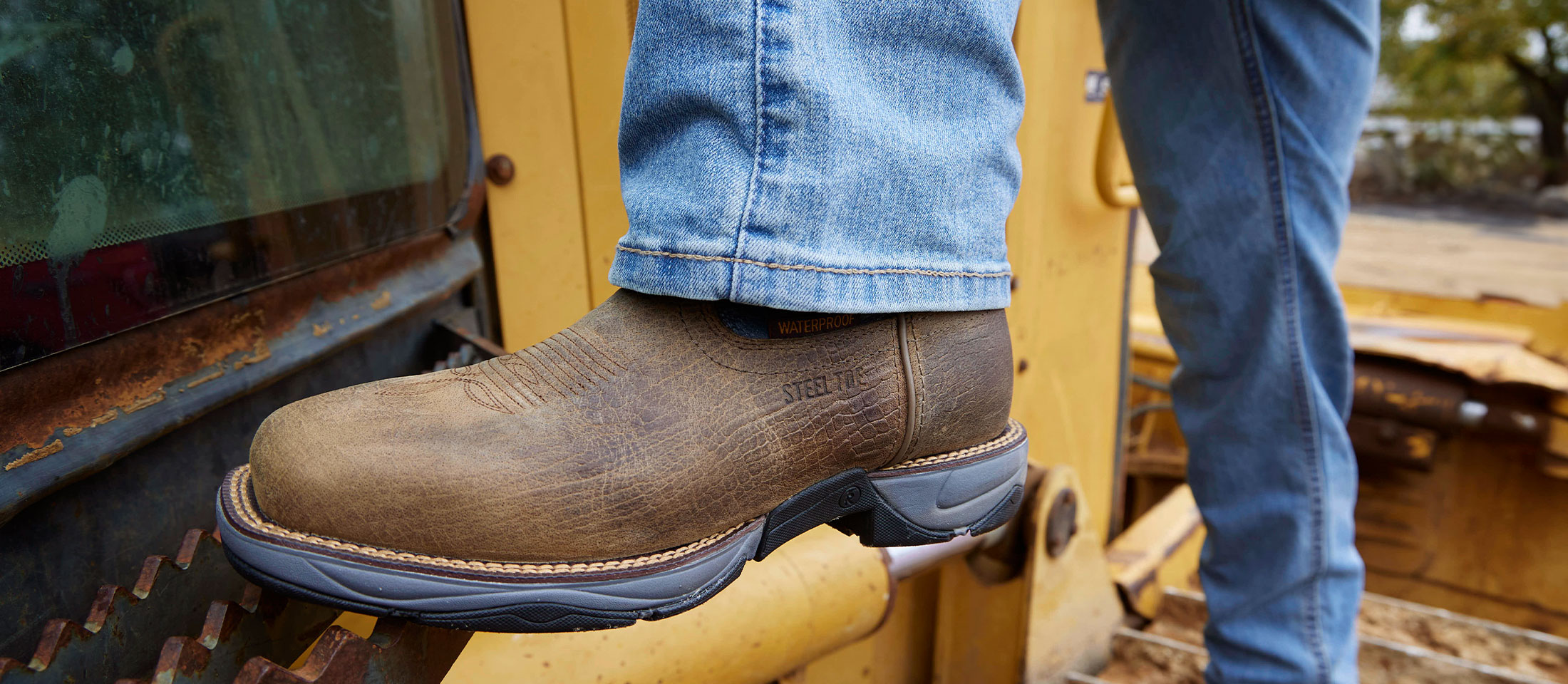 A Man Wearing the Bartlett 11" Pull-On Steel Toe Work Boots in Grey